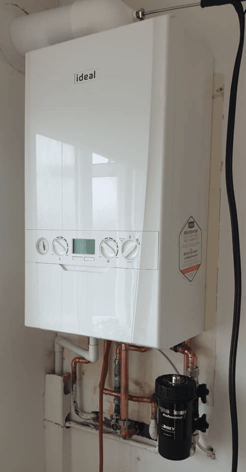 New Ideal combi boiler installed cleanly on the same wall, freshly piped in copper with a magnetic filter on the return